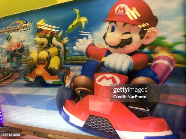 Nintendo's game character Super Mario is seen on a screen in Tokyo, Japan June 28, 2018.