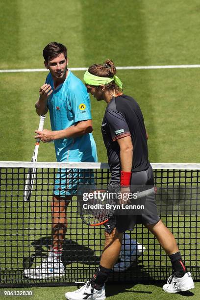 Cameron Norrie of Great Britain talks to Lukas Lacko of Slovakia after their match on day seven of the Nature Valley International at Devonshire Park...