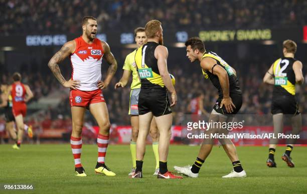Lance Franklin of the Swans and Alex Rance of the Tigers clash during the 2018 AFL round15 match between the Richmond Tigers and the Sydney Swans at...