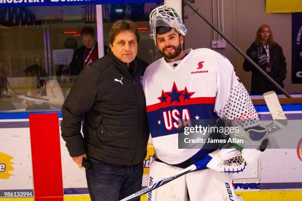 Stop concussions foundation director Kerry Goulet pictured with American goalie Richard Bachman during the Ice Hockey Classic between the United...