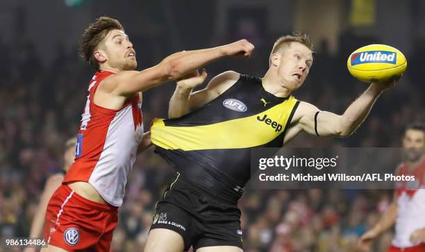 Jack Riewoldt of the Tigers and Dane Rampe of the Swans compete for the ball during the 2018 AFL round15 match between the Richmond Tigers and the...