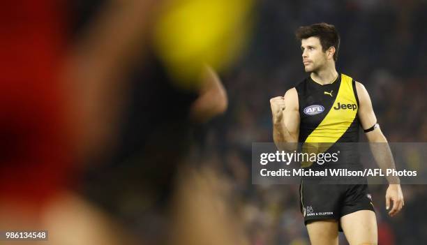 Trent Cotchin of the Tigers celebrates during the 2018 AFL round15 match between the Richmond Tigers and the Sydney Swans at Etihad Stadium on June...