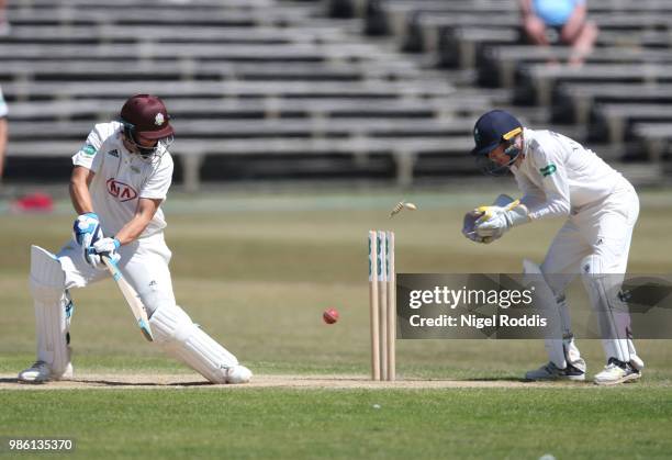 Scott Borthwick of Surrey is bowled out by Jack Leeming of Yorkshire during the Specsavers County Championship Division One match between Yorkshire...