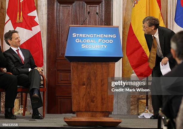 Bill Gates , co-chairman of the Bill and Melinda Gates Foundation, gets up to speak while Treasury Secretary Timothy Geithner sits nearby during an...