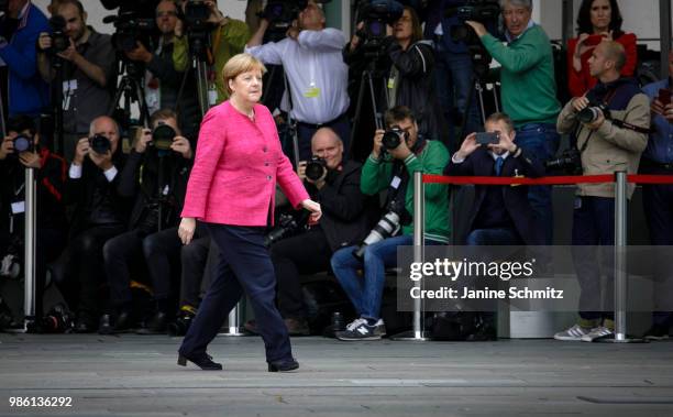 German Chancellor Angela Merkel waits for the Spanish Prime Minister Pedro Sanchez ahead of the welcome ceremony in the courtyard of the German...