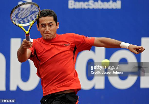 Nicolas Almagro of Spain plays a forehand to Jo-Wilfried Tsonga of France on day four of the ATP 500 World Tour Barcelona Open Banco Sabadell 2010...
