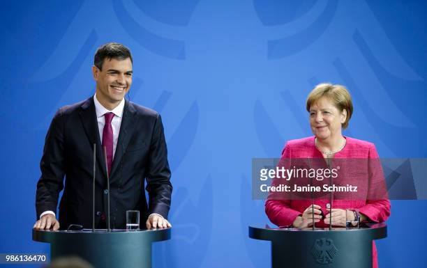 German Chancellor Angela Merkel and Spanish Prime Minister Pedro Sanchez are pictured during a news conference after their meeting in the German...