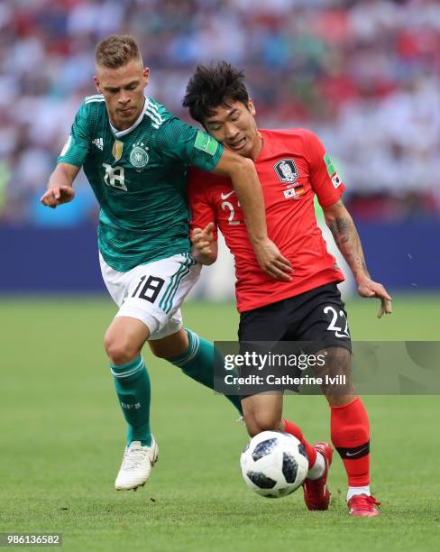 Joshua Kimich of Germany battles with Go Yo-Han of South Korea during the 2018 FIFA World Cup Russia group F match between Korea Republic and Germany...