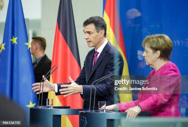 German Chancellor Angela Merkel and Spanish Prime Minister Pedro Sanchez are pictured during a news conference after their meeting in the German...