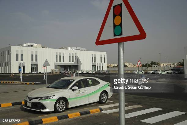 Women instructors and students practice driving at the Jeddah Advanced Driving School at King Abdulaziz University the day after women are once again...