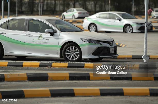 Women instructors and students practice driving at the Jeddah Advanced Driving School at King Abdulaziz University the day after women are once again...