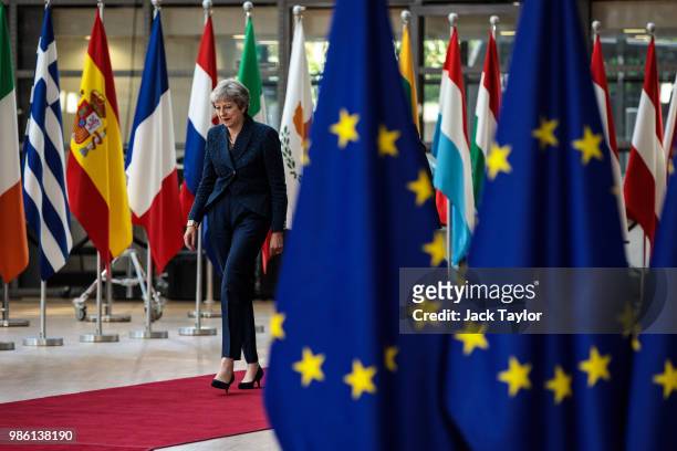 British Prime Minister Theresa May arrives at the Council of the European Union on the first day of the European Council leaders' summit on June 28,...