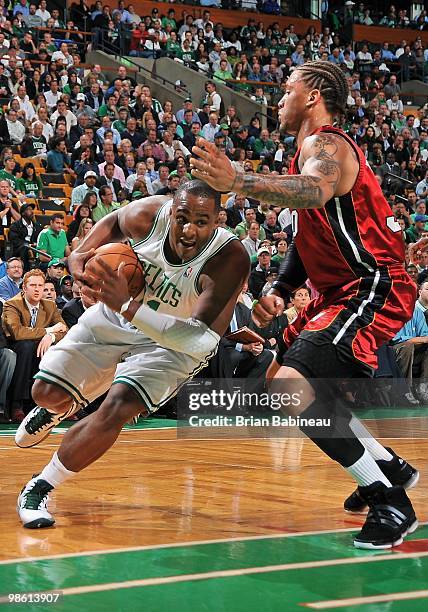Glenn Davis of the Boston Celtics drives against Michael Beasley of the Miami Heat in Game Two of the Eastern Conference Quarterfinals during the...