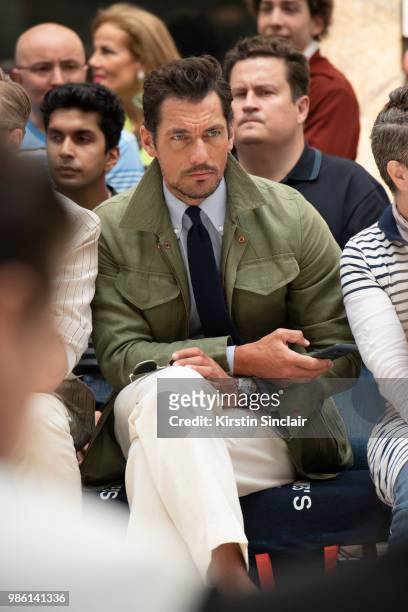 Model David Gandy wears a Thom Sweeney shirt, Emma Willis tie, Private White V.C jacket and trousers during London Fashion Week Men's on June 9, 2018...