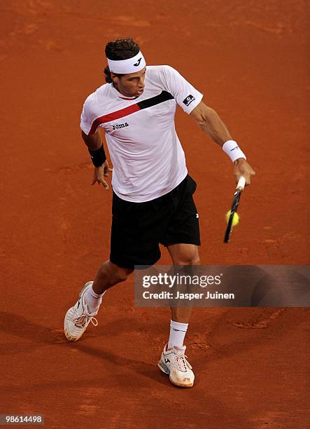 Feliciano Lopez of Spain plays a forehand to Robin Soderling of Sweden on day four of the ATP 500 World Tour Barcelona Open Banco Sabadell 2010...