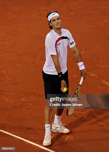 Feliciano Lopez of Spain serves the ball to Robin Soderling of Sweden on day four of the ATP 500 World Tour Barcelona Open Banco Sabadell 2010 tennis...