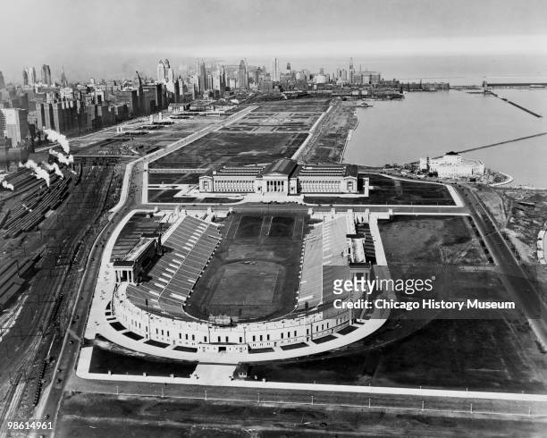 Aerial view of Soldier Field showing the stadium, Lake Michigan, the Field Museum, the Shedd Aquarium under construction, Grant Park, and the Chicago...