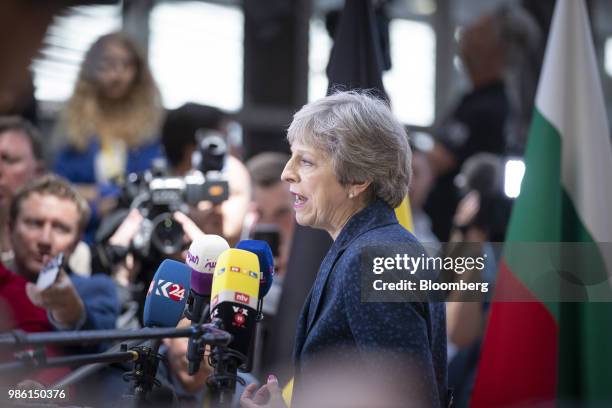 Theresa May, U.K. Prime minister, speaks to the media as she arrives for a European Union leaders summit in Brussels, Belgium, on Thursday, June 28,...