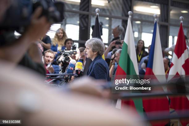 Theresa May, U.K. Prime minister, speaks to the media as she arrives for a European Union leaders summit in Brussels, Belgium, on Thursday, June 28,...