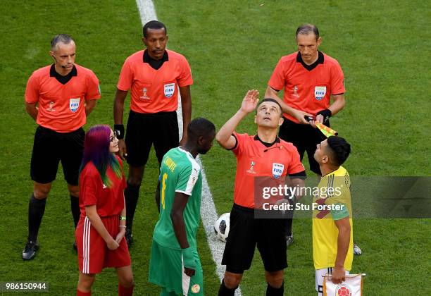 Referee Milorad Mazic performs the toin coss prior to the 2018 FIFA World Cup Russia group H match between Senegal and Colombia at Samara Arena on...