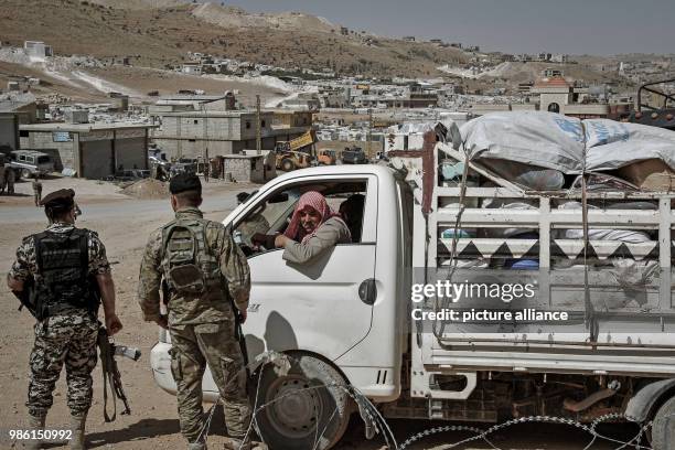 Syrian refugees leave their camp in the border village Arsal, east Lebanon, 28 June 2018. Over 400 refugees have been granted permission from the...