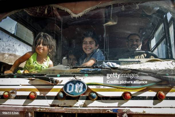 Dpatop - Syrian refugees leave their camp in the border village Arsal, east Lebanon, 28 June 2018. Over 400 refugees have been granted permission...