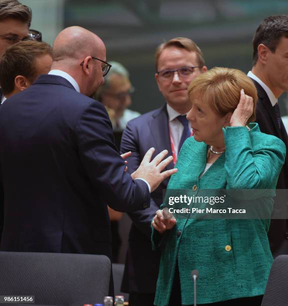 Charles Michel, Prime Minister of Belgium speaks with Angela Merkel, Federal Chancellor during the EU Council Meeting at European Parliament on June...