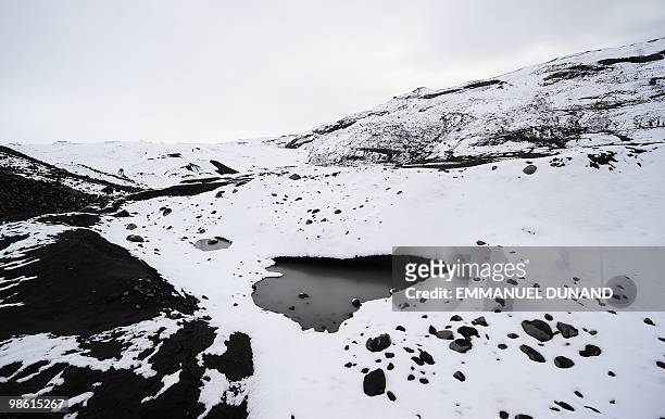 Glacial water accumultes in small pools at the base of the Myrdalsjokull glacier, which is part of the ice cap sealing the Katla volcano, near the...