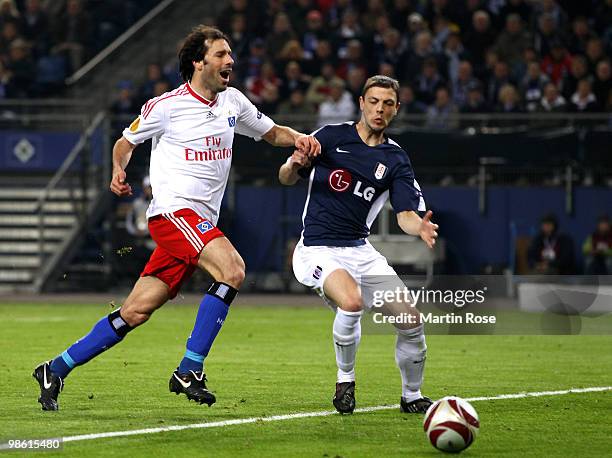 Ruud van Nistelrooy of HSV battles for the ball with Zoltan Gera of Fulham during the UEFA Europa League semi final first leg match between Hamburger...