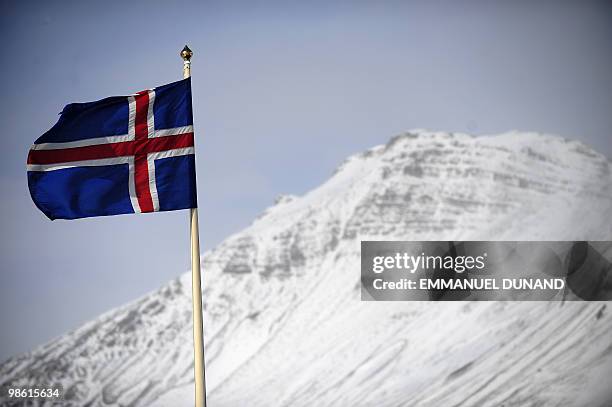 An Icelandic flag flies over Vik, a village sitting at the base of the Myrdalsjokull glacier, which is part of the ice cap sealing the Katla volcano,...