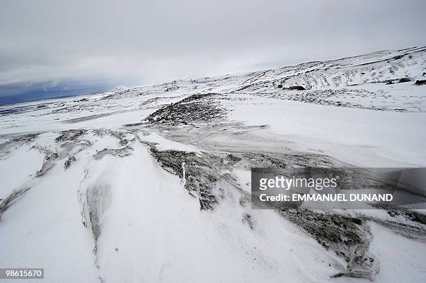 Volcanic ash leaves dark streaks on the Myrdalsjokull glacier, which is part of the ice cap sealing the Katla volcano, near the Icelandic village of...