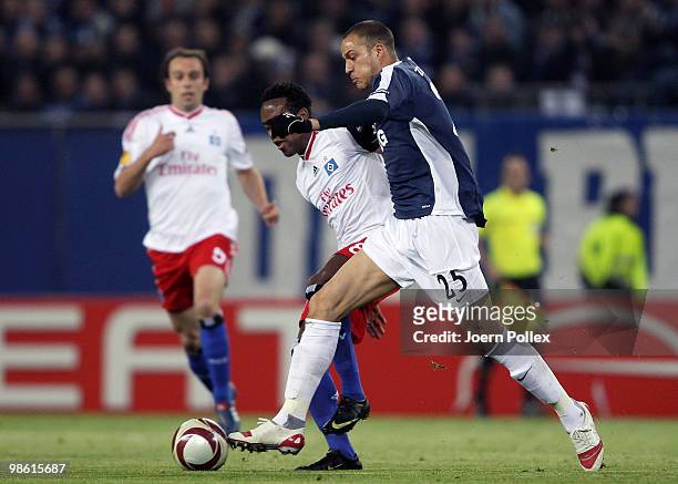 Ze Roberto of Hamburg and Bobby Zamora of Fulham compete for the ball during the UEFA Europa League semi final first leg match between Hamburger SV...