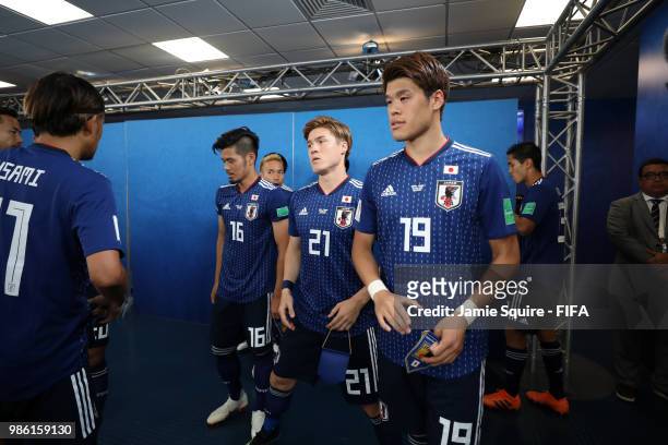 Hotaru Yamaguchi, Gotoku Sakai and Hiroki Sakai of Japan wait in the tunnel prior to the 2018 FIFA World Cup Russia group H match between Japan and...
