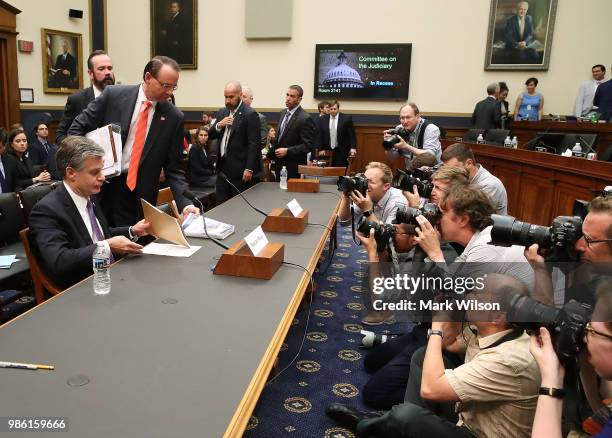 Director Christopher Wray and U.S. Deputy Attorney General Rod Rosenstein arrives to testify before the House Judiciary Committee June 28, 2018 on...