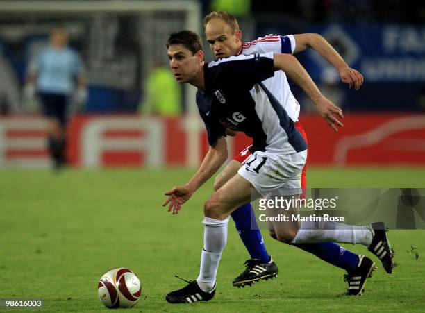David Jarolim of HSV challenges Zoltan Gera of Fulham during the UEFA Europa League semi final first leg match between Hamburger SV and Fulham at HSH...