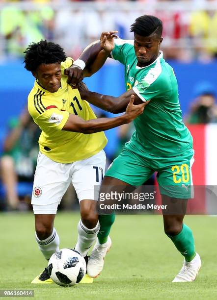 Juan Cuadrado of Colombia battles for possession with Keita Balde of Senegal during the 2018 FIFA World Cup Russia group H match between Senegal and...