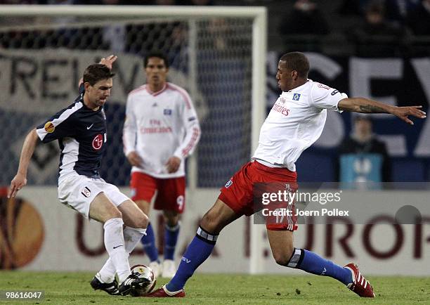 Jerome Boateng of Hamburg and Zoltan Gera of Fulham compete for the ball during the UEFA Europa League semi final first leg match between Hamburger...