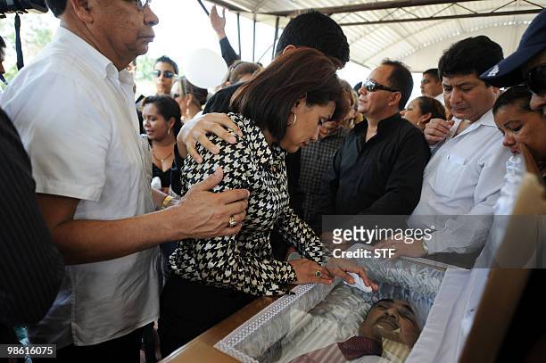 Silvia Munguia , widow of television journalist and university professor Jorge Alberto Orellana, mourns him previous to his burial held in San Pedro...