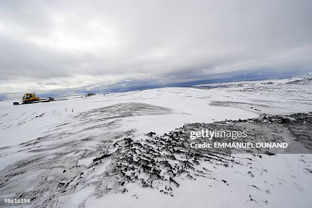 Volcanic ash leaves dark streaks on the Myrdalsjokull glacier, which is part of the ice cap sealing the Katla volcano, near the Icelandic village of...