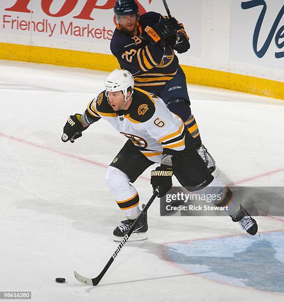 Dennis Weidman of the Boston Bruins skates against Jason Pominville of the Buffalo Sabres in Game Two of the Eastern Conference Quarterfinals during...