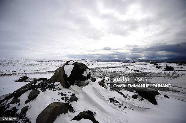 Volcanic boulders sit atop the Myrdalsjokull glacier, which is part of the ice cap sealing the Katla volcano, near the Icelandic village of Vik, on...