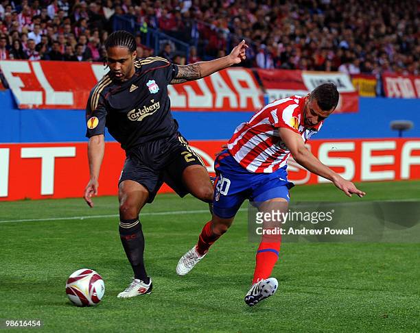 Glen Johnson of Liverpool competes with Simao of Athletico Madrid during the UEFA Europa League Semi-Finals First Leg match between Atletico Madrid...
