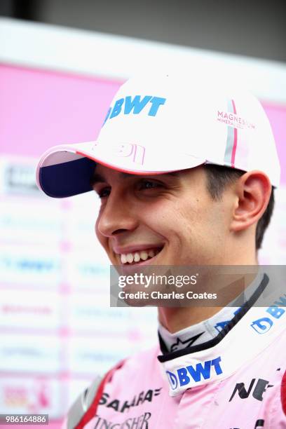 Esteban Ocon of France and Force India talks to the media in the Paddock during previews ahead of the Formula One Grand Prix of Austria at Red Bull...