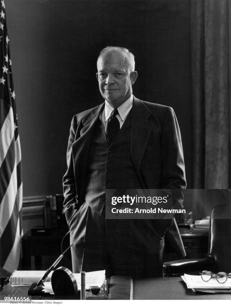 Portrait of American military commander General Dwight D Eisenhower in his office at Columbia University, where he served at the university's...