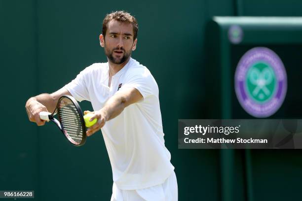 Marin Cilic of Craotia practices on court during training for the Wimbledon Lawn Tennis Championships at the All England Lawn Tennis and Croquet Club...