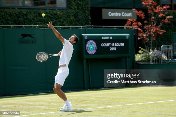 Marin Cilic of Craotia practices on court during training for the Wimbledon Lawn Tennis Championships at the All England Lawn Tennis and Croquet Club...
