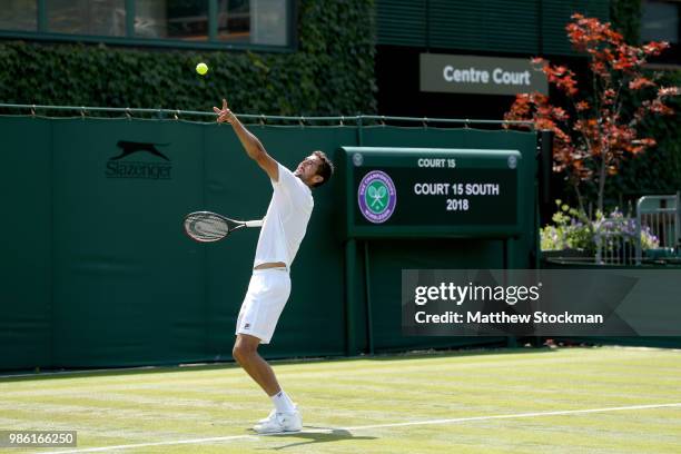 Marin Cilic of Craotia practices on court during training for the Wimbledon Lawn Tennis Championships at the All England Lawn Tennis and Croquet Club...