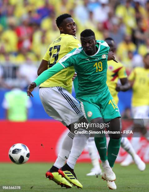 Mbaye Niang of Senegal and Yerry Mina of Colombia compete for the ball during the 2018 FIFA World Cup Russia group H match between Senegal and...