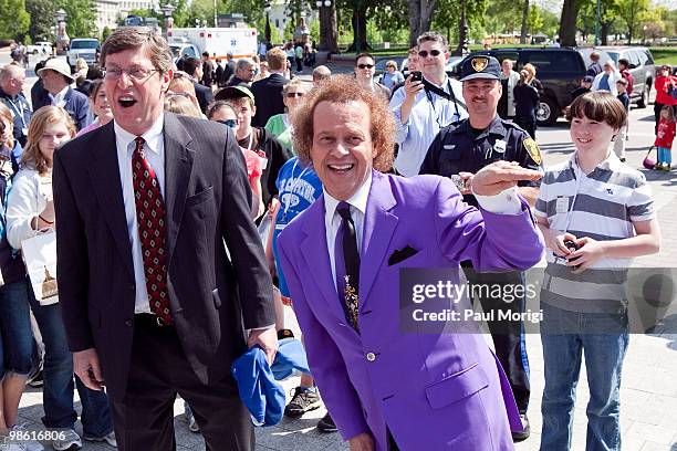 Richard Simmons celebrates the passage of the Fitness Integrated with Teaching Kids Act with a group of tourists at the US Capitol on April 22, 2010...