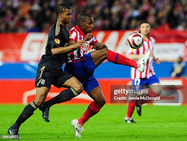 Luis Amaranto Perea of Atletico Madrid holds off David N'Gog of Liverpool during the UEFA Europa League Semi Final first leg match between Atletico...